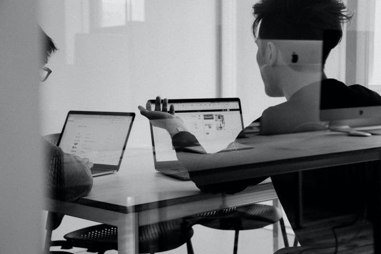 Guys in the computer black and white picturos two guys in the back