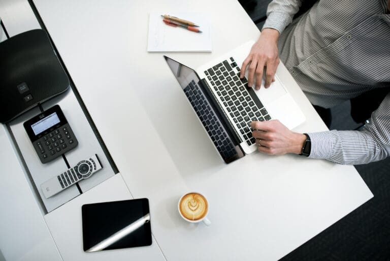 Tools and Coffee in the Table While Writing
