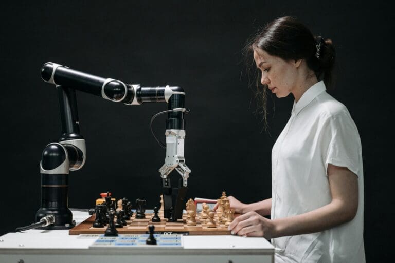Girl playing with Chess robot